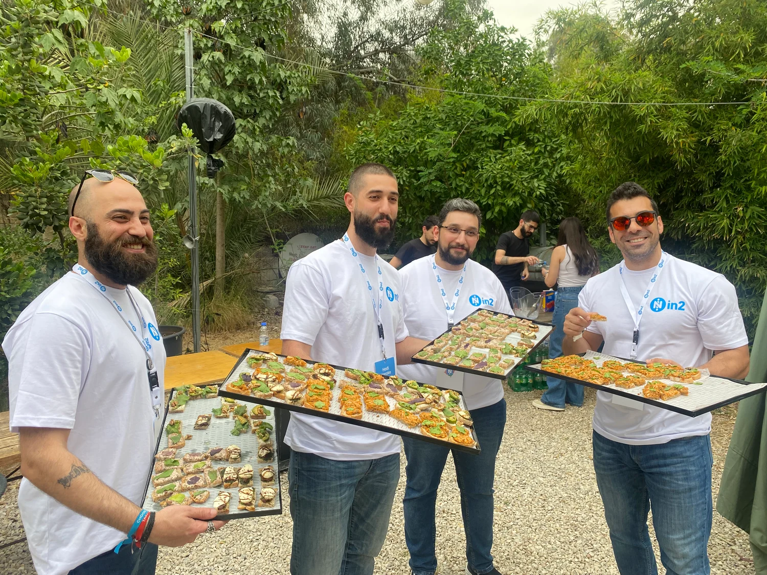 in2 Team Holding Food